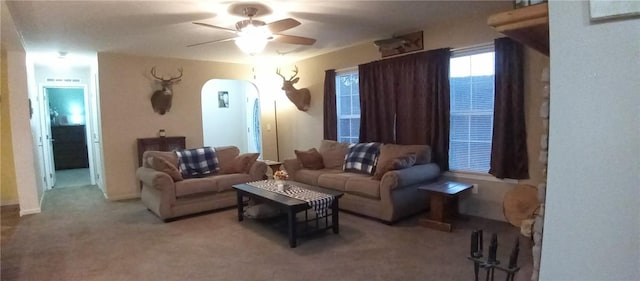1058 County Highway 44, Sidney, NY 13775 - living area featuring arched walkways, carpet floors, and ceiling fan