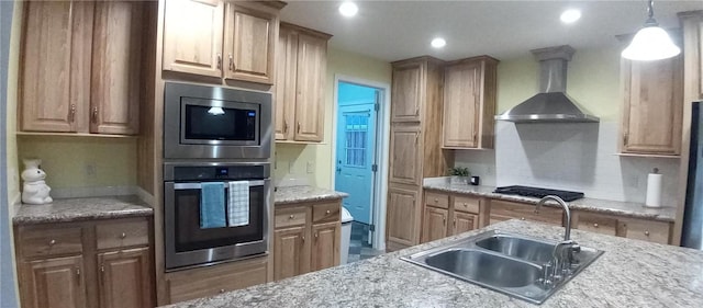 1058 County Highway 44, Sidney, NY 13775 - kitchen with appliances with stainless steel finishes, wall chimney exhaust hood, decorative light fixtures, recessed lighting, and light stone countertops