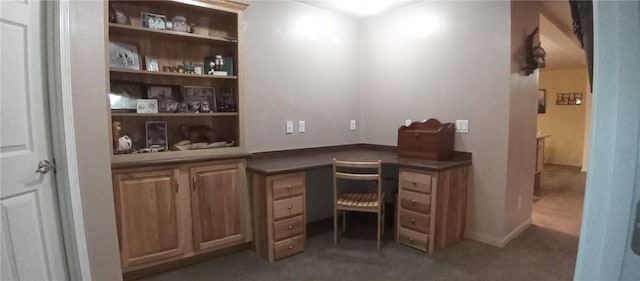 1058 County Highway 44, Sidney, NY 13775 - home office with built in desk, carpet floors, and arched walkways