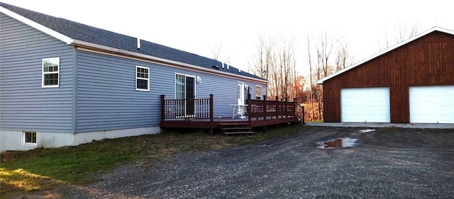 1058 County Highway 44, Sidney, NY 13775 - view of side of property with a deck, an outbuilding, and a detached garage