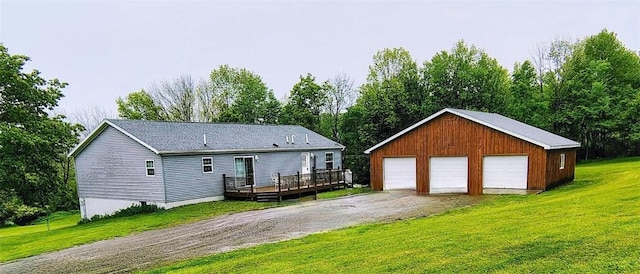 1058 County Highway 44, Sidney, NY 13775 - back of house featuring a detached garage, a deck, an outdoor structure, and a lawn