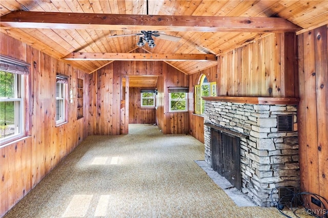 2900 W Lake Rd, Skaneateles, NY 13152 - unfurnished living room featuring wood ceiling, wood walls, a fireplace, and carpet