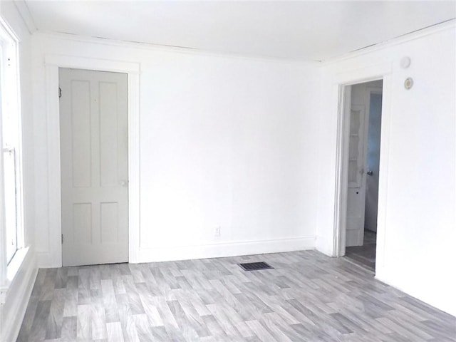 94 Locust St, Rochester, NY 14613 - empty room with baseboards, light wood-type flooring, and ornamental molding