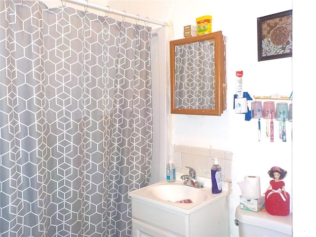 94 Locust St, Rochester, NY 14613 - full bath with toilet, vanity, and a shower with curtain