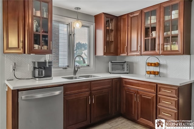 62 Thistle Ave, Tonawanda-Town, NY 14150 - kitchen with stainless steel dishwasher, a sink, light countertops, and glass insert cabinets