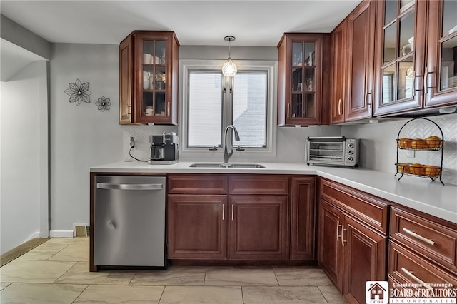 62 Thistle Ave, Tonawanda-Town, NY 14150 - kitchen featuring dishwasher, a sink, light countertops, and decorative backsplash