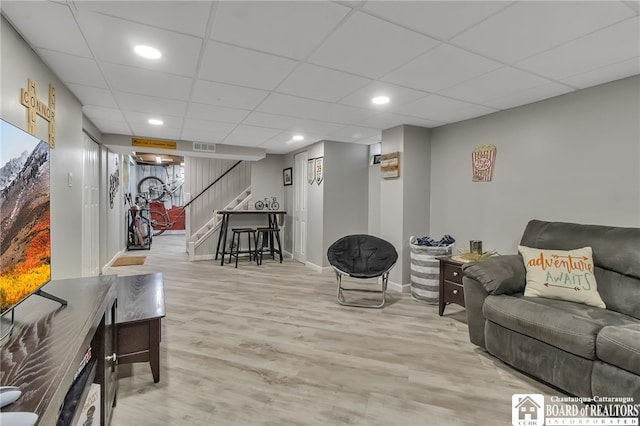 62 Thistle Ave, Tonawanda-Town, NY 14150 - living area with stairs, light wood-style flooring, baseboards, a drop ceiling, and recessed lighting