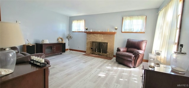 323 Portage Rd, Niagara Falls, NY 14303 - living room with wood finished floors, a fireplace, and baseboards