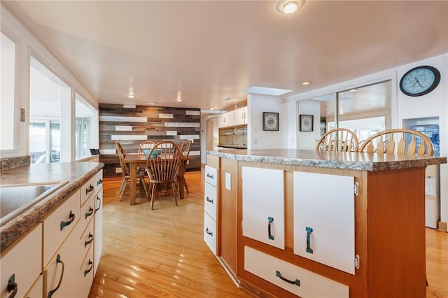 2171 Hansen Point Rd, Torrey, NY 14527 - kitchen with light wood-style flooring and a kitchen island