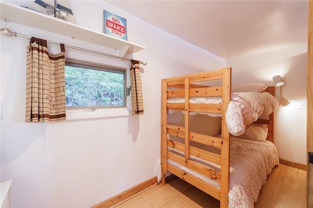 2171 Hansen Point Rd, Torrey, NY 14527 - bedroom featuring wood finished floors and baseboards