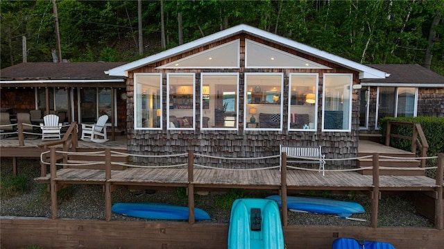 2171 Hansen Point Rd, Torrey, NY 14527 - back of property featuring a wooden deck and a sunroom