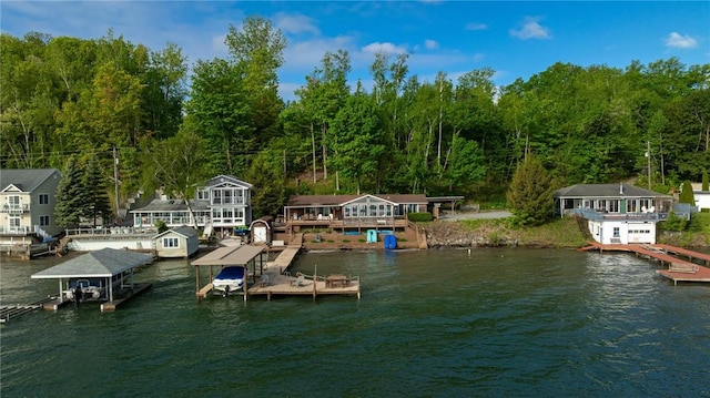 2171 Hansen Point Rd, Torrey, NY 14527 - dock featuring a water view, a forest view, and boat lift