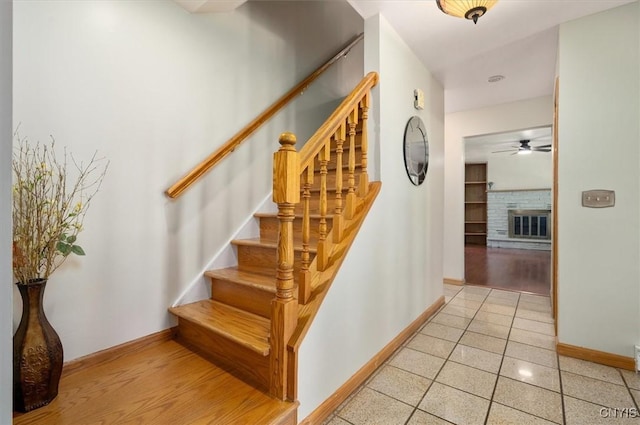 6 Viburnum Pl, New Hartford, NY 13413 - stairs with baseboards, ceiling fan, and a glass covered fireplace