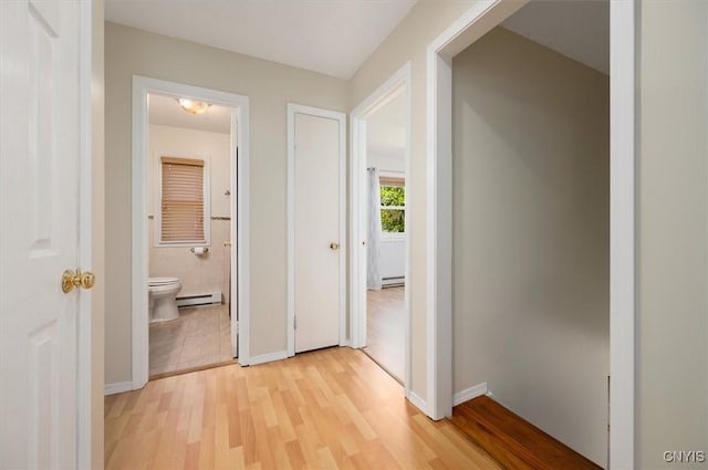 6 Viburnum Pl, New Hartford, NY 13413 - corridor featuring a baseboard radiator, light wood-style flooring, a baseboard heating unit, and baseboards