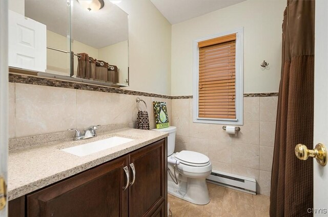 6 Viburnum Pl, New Hartford, NY 13413 - bathroom featuring a baseboard radiator, tile walls, tile patterned floors, toilet, and vanity
