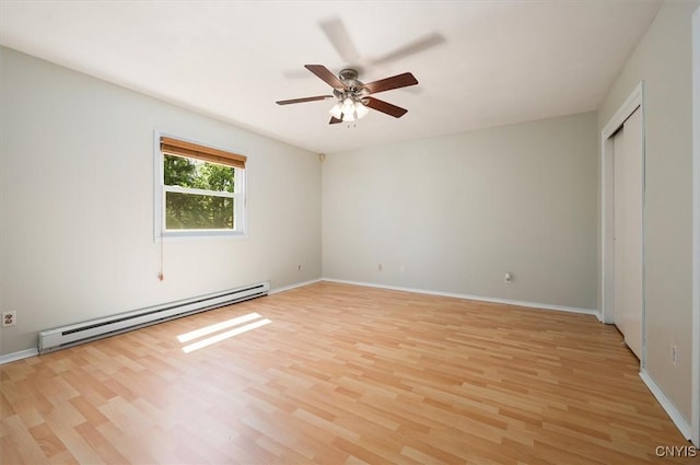 6 Viburnum Pl, New Hartford, NY 13413 - unfurnished bedroom featuring baseboard heating, light wood-style floors, and baseboards