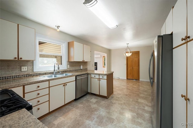 6 Viburnum Pl, New Hartford, NY 13413 - kitchen featuring appliances with stainless steel finishes, a sink, a peninsula, backsplash, and decorative light fixtures
