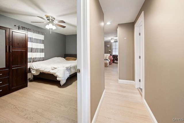 32 E 5th St, Oswego-City, NY 13126 - bedroom with light wood-style floors, baseboards, and ceiling fan