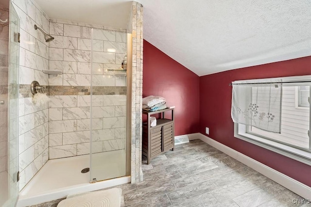 32 E 5th St, Oswego-City, NY 13126 - full bathroom featuring a stall shower, vaulted ceiling, and baseboards