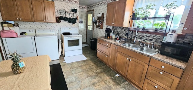 1171 Charles St, Southport, NY 14904 - kitchen featuring black microwave, white range with electric cooktop, washing machine and dryer, and brown cabinets