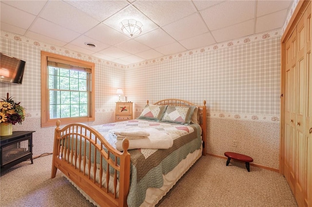 5889 W Bluff Dr, Jerusalem, NY 14478 - bedroom with wallpapered walls, light carpet, and a drop ceiling