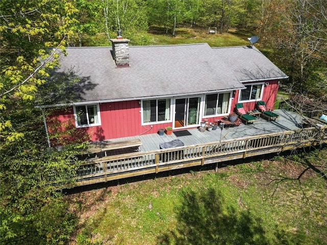 100 Clear Springs Ln, Middletown, NY 12430 - back of house with a shingled roof, a wooden deck, a chimney, and a wooded view