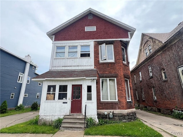 231 Lansing St, Utica, NY 13501 - view of front facade featuring entry steps and board and batten siding