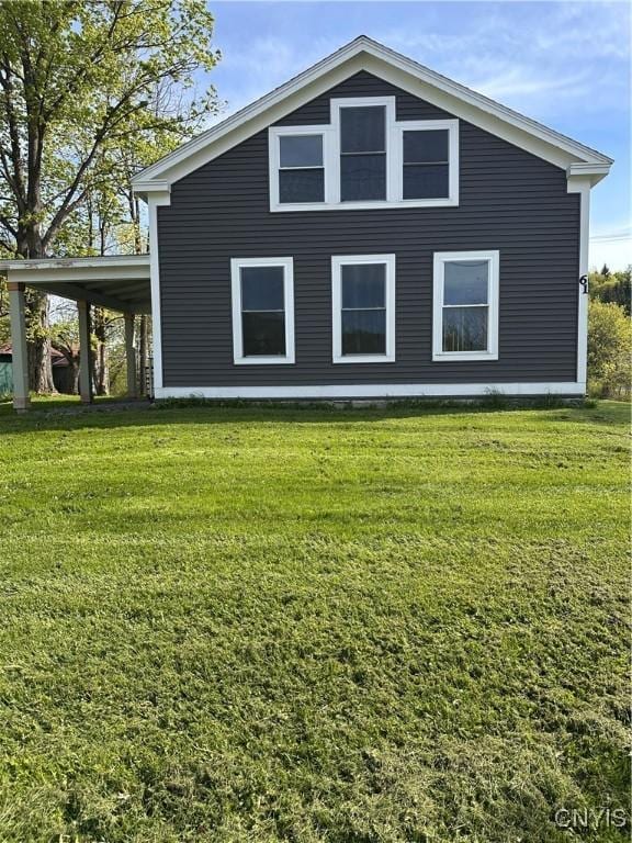 61 W Main St, Eaton, NY 13408 - view of side of home featuring a yard