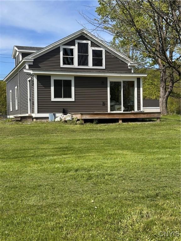 61 W Main St, Eaton, NY 13408 - rear view of house with a lawn and a wooden deck