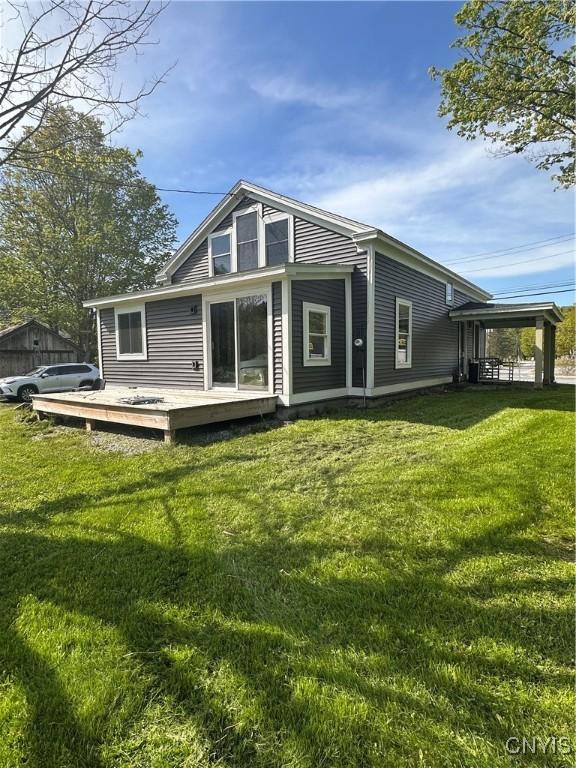 61 W Main St, Eaton, NY 13408 - back of house with a deck and a yard