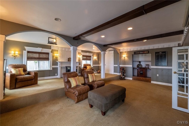 1079 State Route 49, Constantia, NY 13028 - carpeted living room with ornate columns, arched walkways, beam ceiling, baseboards, and recessed lighting