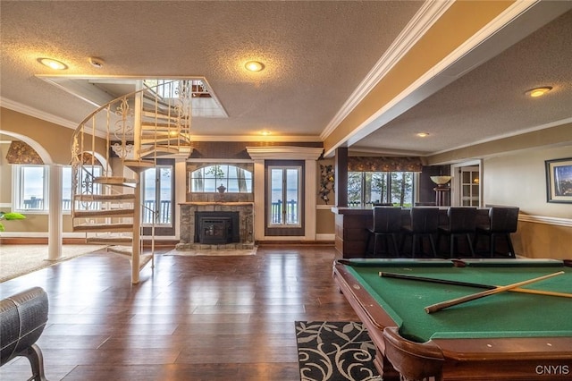 1079 State Route 49, Constantia, NY 13028 - game room featuring a textured ceiling, ornamental molding, wood finished floors, a stone fireplace, and baseboards