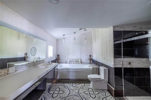 1079 State Route 49, Constantia, NY 13028 - bathroom with a bath, toilet, tiled shower, vaulted ceiling, and vanity