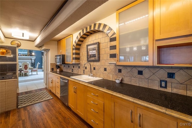 1079 State Route 49, Constantia, NY 13028 - kitchen featuring a sink, appliances with stainless steel finishes, dark wood-style floors, backsplash, and glass insert cabinets