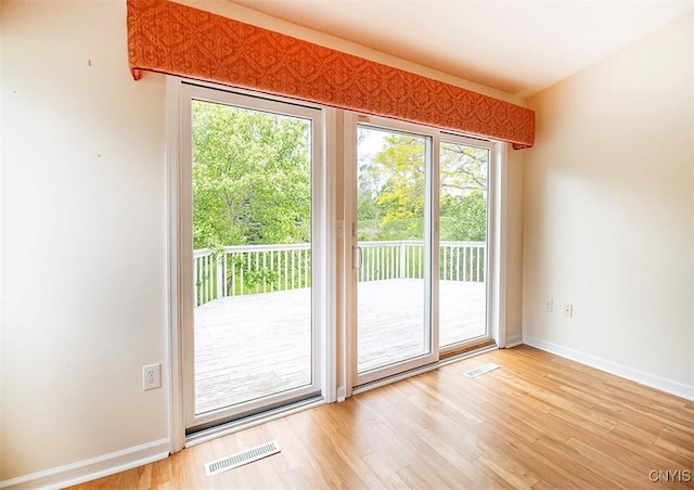 4951 Ravine Rd, Manlius, NY 13066 - doorway featuring wood finished floors and baseboards