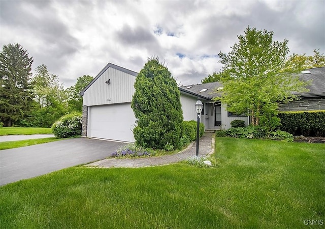4951 Ravine Rd, Manlius, NY 13066 - view of front of home featuring a front yard, driveway, and an attached garage