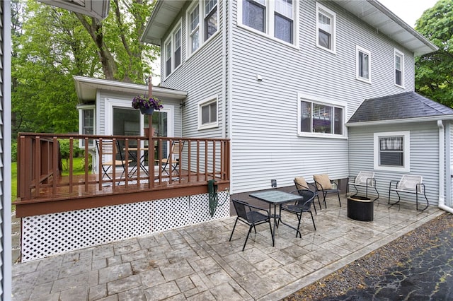 540 List Ave, Irondequoit, NY 14617 - rear view of house featuring a wooden deck and a patio area
