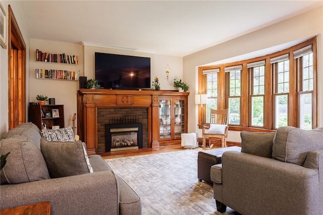540 List Ave, Irondequoit, NY 14617 - living area featuring a brick fireplace and wood finished floors