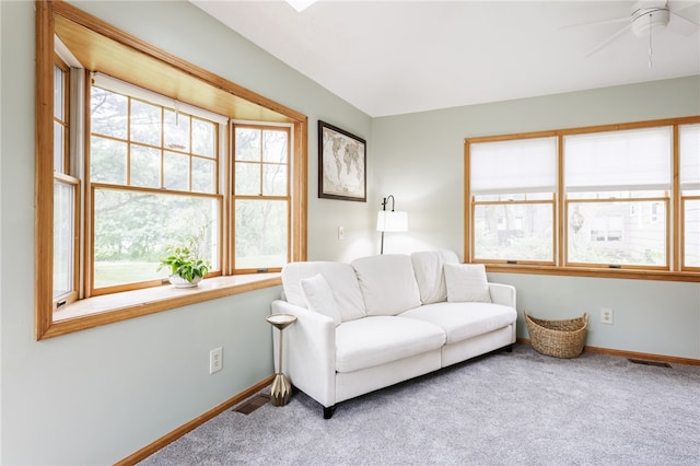 540 List Ave, Irondequoit, NY 14617 - carpeted living room with plenty of natural light, baseboards, and a ceiling fan