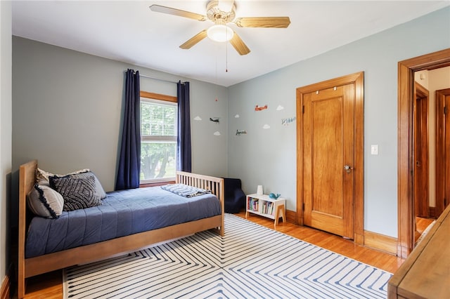 540 List Ave, Irondequoit, NY 14617 - bedroom with light wood finished floors, ceiling fan, and baseboards