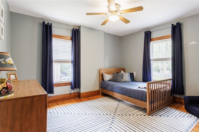 540 List Ave, Irondequoit, NY 14617 - bedroom featuring light wood-type flooring, multiple windows, and baseboards