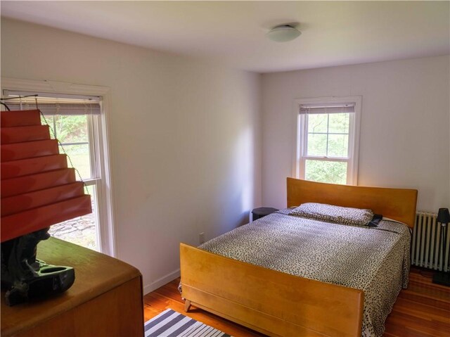 36 Pinetree Ln, Middletown, NY 12430 - bedroom featuring radiator heating unit, wood finished floors, and baseboards