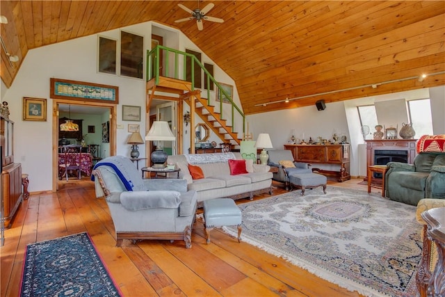 278 Taylor Rd, Jefferson, NY 12167 - living area featuring ceiling fan, wood ceiling, hardwood / wood-style flooring, stairway, and high vaulted ceiling