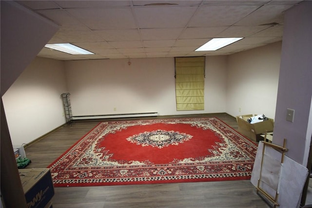 220 New Wickham Dr Unit 220, Penfield, NY 14526 - spare room with baseboard heating, wood finished floors, and a drop ceiling