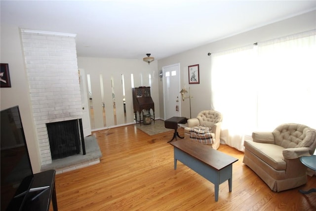 220 New Wickham Dr Unit 220, Penfield, NY 14526 - living room with light wood finished floors and a fireplace