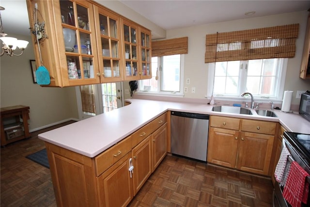220 New Wickham Dr Unit 220, Penfield, NY 14526 - kitchen featuring appliances with stainless steel finishes, a sink, light countertops, glass insert cabinets, and a chandelier