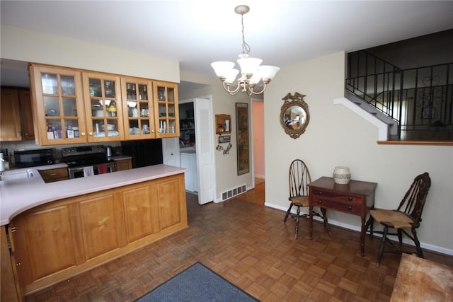 220 New Wickham Dr Unit 220, Penfield, NY 14526 - kitchen featuring stainless steel range with electric cooktop, black microwave, a chandelier, glass insert cabinets, and light countertops