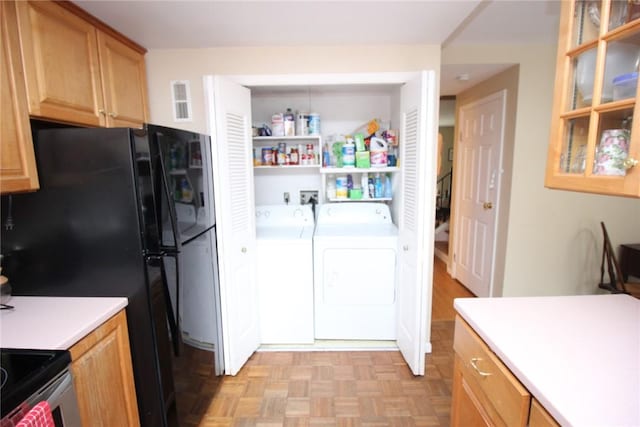 220 New Wickham Dr Unit 220, Penfield, NY 14526 - kitchen featuring washing machine and clothes dryer, light countertops, freestanding refrigerator, and glass insert cabinets
