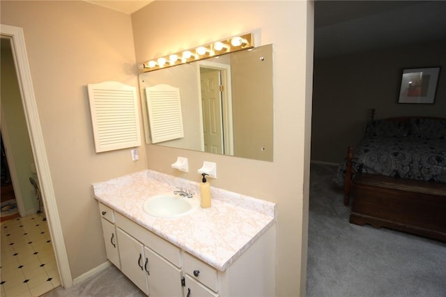 220 New Wickham Dr Unit 220, Penfield, NY 14526 - bathroom featuring baseboards, vanity, and ensuite bathroom