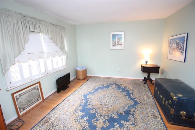 220 New Wickham Dr Unit 220, Penfield, NY 14526 - sitting room with wood finished floors and baseboards